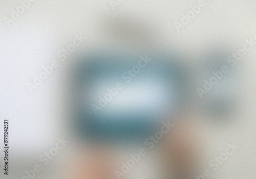 Foto Blurred abstract shape on a light-colored fabric background