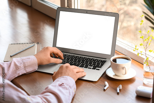 Man working with laptop at ...