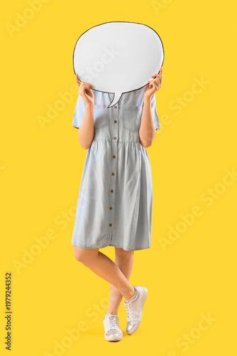 Young woman hiding face beh...
