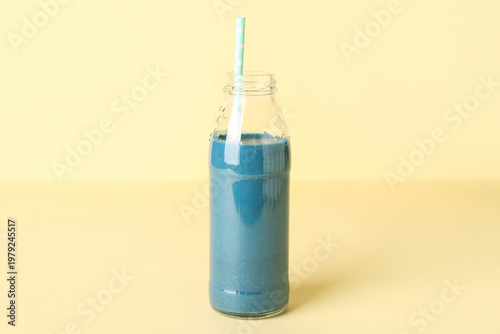 Glass bottle of tasty blue ...