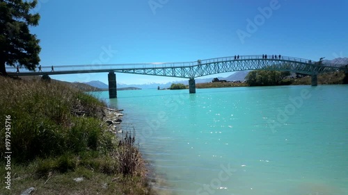 Pedestrian Bridge Over Turquoise Lake