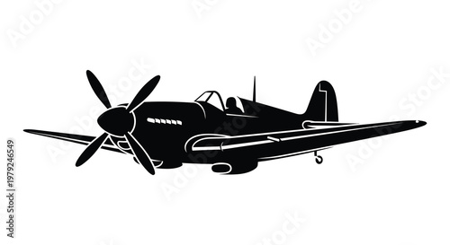 Cuadro en lienzo A striking black silhouette of a vintage world war two fighter plane in mid flig