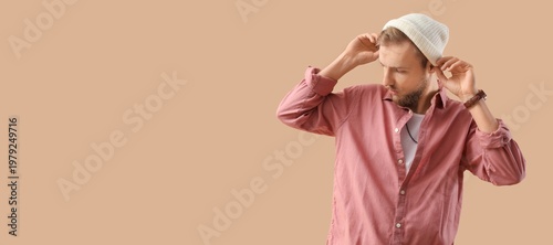 Stylish young bearded man i...