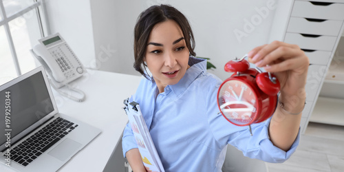 Businesswoman with papers a...