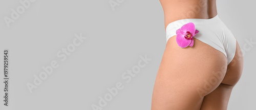 Young woman in panties with...