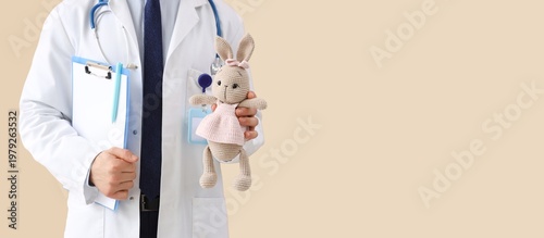 Male pediatrician with clip...