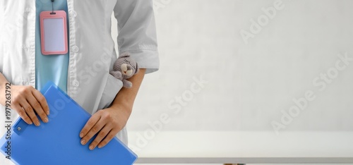 Female pediatrician with to...