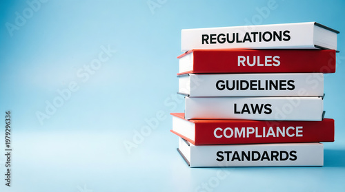 A stack of books about regulations, rules, and compliance on a blue background
