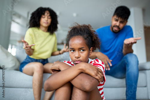 Cuadro en lienzo Frustrated African American father and mother scolding their upset young daughter at home