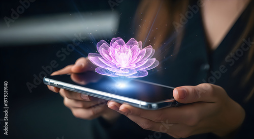 Hands holding smartphone with glowing digital lotus flower hologram for futuristic technology and innovation concept