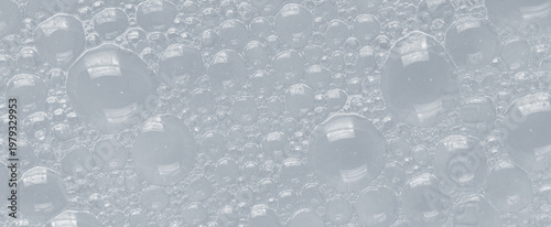 Bubbles of body gel or soap foam or shaving gel. Closeup.