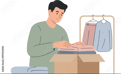 Man packing clothes into a cardboard box beside a clothing rack
