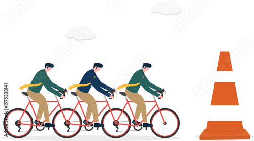 Team of professionals cycling towards a traffic cone