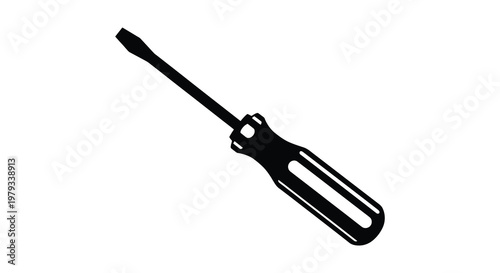 A black flathead screwdriver depicted in a stark dramatic silhouette