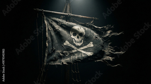 Foto Old tattered pirate flag the jolly roger a prominent skull and crossbones design