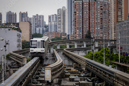 Subway train surrounded by buildings in central downtown Chongqing, China