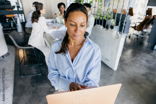 Resourceful Startup Founder Passionately Focusing On Business Plans Within Calm Office Surroundings