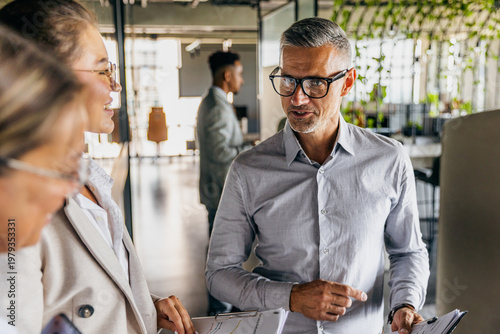 Senior consultant delivering client pitch with confident energy