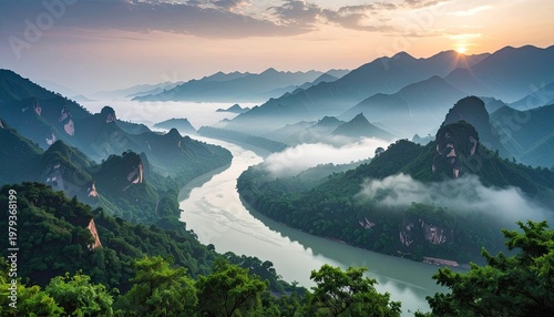 A breathtaking panoramic view showcases a winding river gracefully carving its path through lush, mist-shrouded mountains at sunset, creating a serene and picturesque landscape.