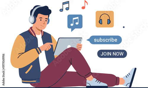 Young man sitting on floor wearing headphones and using tablet