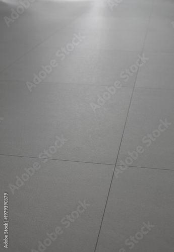 
The living room has a beige hardwood floor.