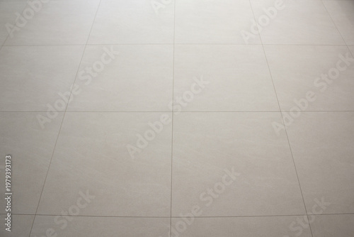 
The living room has a beige hardwood floor.