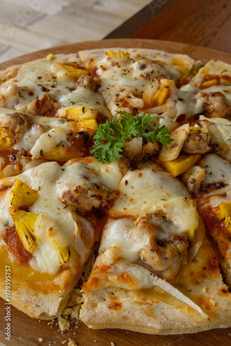 Close up macro of delicious baked pizza with melted cheese and pineapple
