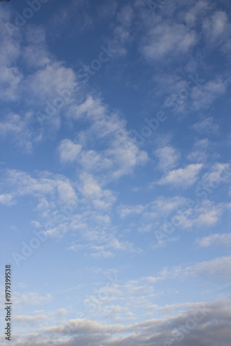 The sky is covered with fluffy clouds
