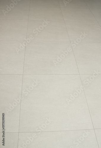 
The living room has a beige hardwood floor.