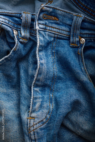 Close-up of the fly of an old pair of jeans.