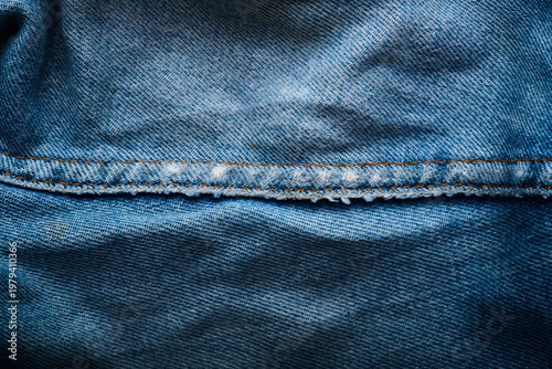 Close-up of the stitching on an old pair of jeans