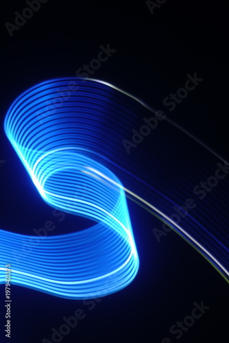 Electric blue light trails against a deep black background