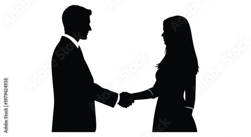 Business partners completing a deal shaking hands in a striking silhouette