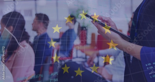 Watching seated staff in business attire in office viewing EU graphs, tablet with stylus, lanyard