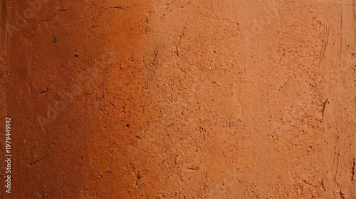 Red clay soil texture background with organic earthy details. Natural terracotta mud surface for construction, agriculture, pottery, and rustic mediterranean architectural design.
