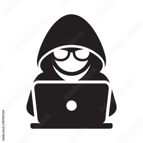 A hooded figure operates a laptop symbolizing anonymity and digital activity