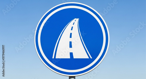 Blue circular road sign with white curved highway symbol.