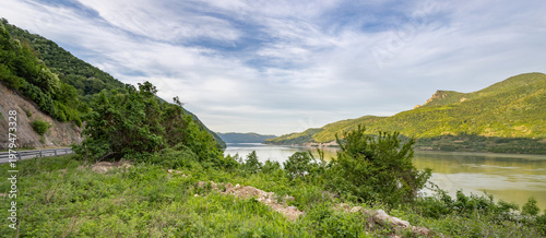 Wallpaper Mural Beautiful landscape with a green hillside and a lake Torontodigital.ca