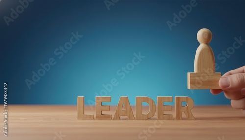 Wooden figurine being placed on a wooden base next to the word 