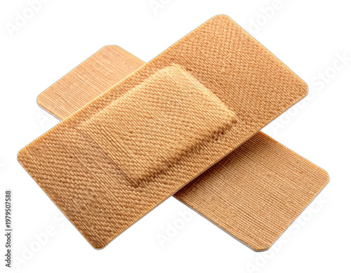 A close-up shot showcases two adhesive bandages overlapping against a stark black background, highlighting their medical utility and textured surface.
