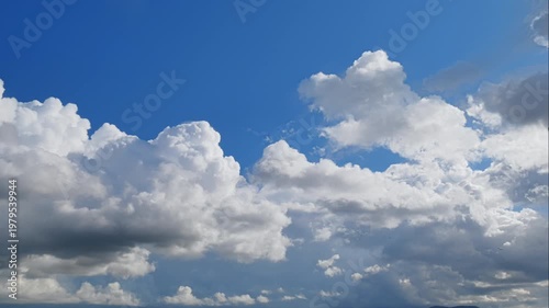 Sunny Day Sky Timelapse with Beautiful White Fluffy Clouds Moving Fast in Blue