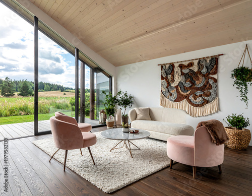 Modern living room with large windows overlooking a scenic landscape