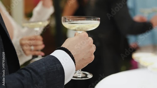 Man In Suit Holding Stemware During Gala, Closeup Of Hand And Cufflink Raising Sparkling Drink