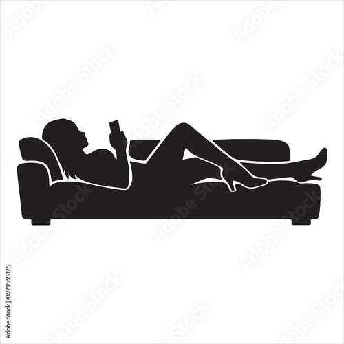 A woman lies on a couch looking at her phone