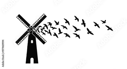 Windmill silhouette releases a flock of birds into the sky as a symbol of freedom.