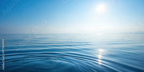 Wallpaper Mural Calm ocean water with gentle ripples under bright sunlight and clear blue sky creating peaceful and serene atmosphere Torontodigital.ca