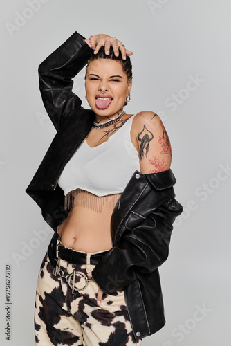 Young stylish woman showcasing bold fashion in a modern studio setting