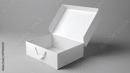 Square white box, lid slightly ajar, with a curved handle, resting on a gray surface