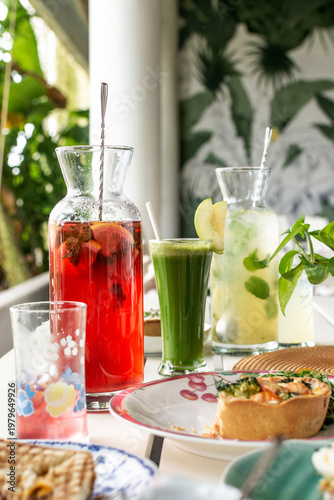 mixed drinks on brunch restaurant table outdoors in singapore garden cafe restaurant