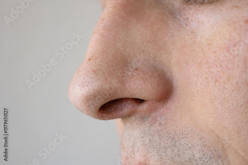 Photos Macro close up of an unrecognizable Caucasian man's nose showing skin pores and